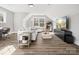 Spacious living room featuring modern furniture, natural light, and entertainment setup at 111 Alberta Ave, Belmont, NC 28012