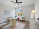 Bright home office space featuring modern desk and chairs, a whiteboard, and a large window at 111 Alberta Ave, Belmont, NC 28012