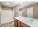 Main bathroom with double vanity and shower/tub combo at 119 Lookout Point Pl, Mooresville, NC 28115