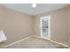 Bright bedroom with door leading to exterior at 119 Lookout Point Pl, Mooresville, NC 28115