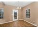 Bright dining room with hardwood floors and neutral walls at 119 Lookout Point Pl, Mooresville, NC 28115