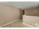 Upper hallway with neutral colored walls and carpeted floors at 119 Lookout Point Pl, Mooresville, NC 28115