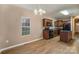 Eat-in kitchen with dark wood cabinets, granite countertops, and island at 119 Lookout Point Pl, Mooresville, NC 28115