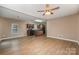 Open concept living room and kitchen with hardwood floors at 119 Lookout Point Pl, Mooresville, NC 28115