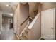 Staircase leading upstairs with hardwood floors and neutral walls at 119 Lookout Point Pl, Mooresville, NC 28115