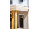 Close-up of the front entrance featuring natural wood porch columns and a modern black front door at 1479 Earl St, Hickory, NC 28602