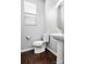 Small bathroom with pedestal sink, toilet, and dark hardwood floor at 1969 Tablerock Dr, Lake Wylie, SC 29745