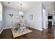 Cozy dining room with wood floors, decorative lighting, and rustic table set for meal at 1969 Tablerock Dr, Lake Wylie, SC 29745