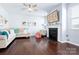 Spacious living room featuring a fireplace, hardwood floors, and stylish furniture at 1969 Tablerock Dr, Lake Wylie, SC 29745