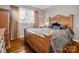 Bedroom features a decorative wooden headboard and hardwood floors at 2319 Tin Mine Rd, Lincolnton, NC 28092