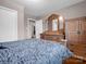 Cozy bedroom with a wooden dresser and a comfortable-looking bed at 2319 Tin Mine Rd, Lincolnton, NC 28092