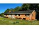 Charming brick home with lush front yard and inviting entrance and well maintained landscape at 2319 Tin Mine Rd, Lincolnton, NC 28092