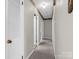 Hallway with carpet and several doors at 2319 Tin Mine Rd, Lincolnton, NC 28092