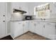 Functional kitchen with classic white cabinets, ample counter space, and modern microwave at 2319 Tin Mine Rd, Lincolnton, NC 28092