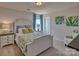 Well lit bedroom with a comfortable bed, bedside tables, and ample space, all exuding a cozy atmosphere at 320 Coronado Ave, Matthews, NC 28104