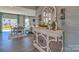 Inviting dining area with stylish decor, hardwood floors, and a seamless transition to the living room at 320 Coronado Ave, Matthews, NC 28104