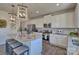 Bright kitchen with stainless steel appliances, white cabinets, granite countertops, and a central island with barstool seating at 320 Coronado Ave, Matthews, NC 28104