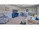 Cozy living room features a plush sofa, decorative pillows, a TV, and a charming dining area at 320 Coronado Ave, Matthews, NC 28104