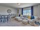Bright living room with a large window, comfortable sectional sofa, and stylish decor at 320 Coronado Ave, Matthews, NC 28104