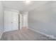 Bright bedroom featuring double doors and neutral wall colors at 4113 Black Ct # 167, Harrisburg, NC 28075