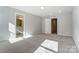Well-lit bedroom with access to bathroom and hallway at 4113 Black Ct # 167, Harrisburg, NC 28075
