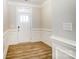 Bright entryway with white trim, wood-look floors, and a front door at 4113 Black Ct # 167, Harrisburg, NC 28075