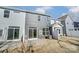 Townhome exterior showcasing gray siding, private patio, and fenced yard at 4113 Black Ct # 167, Harrisburg, NC 28075