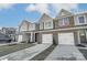 Three-unit townhome building, one unit available. Brick and siding exterior, two-car garages at 4113 Black Ct # 167, Harrisburg, NC 28075