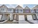Three-unit townhome building, two units available. Brick and siding exterior, two-car garages at 4113 Black Ct # 167, Harrisburg, NC 28075