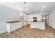 Modern kitchen with white cabinets, granite countertops, and an island at 4113 Black Ct # 167, Harrisburg, NC 28075
