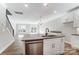 Modern kitchen with white cabinets, granite countertops and island with sink at 4113 Black Ct # 167, Harrisburg, NC 28075