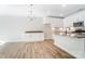 Bright kitchen with white cabinets and hardwood floors at 4113 Black Ct # 167, Harrisburg, NC 28075