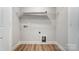 Laundry closet with shelving and built in pet door at 4113 Black Ct # 167, Harrisburg, NC 28075