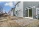 Private backyard patio with stone pavers and a white fence at 4113 Black Ct # 167, Harrisburg, NC 28075