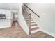 Modern staircase with dark wood railings and white risers at 4113 Black Ct # 167, Harrisburg, NC 28075