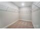 Spacious walk-in closet with wire shelving and carpet at 4113 Black Ct # 167, Harrisburg, NC 28075