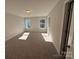 Spacious bedroom with carpeted floor and large windows at 4125 Black Ct # 169, Harrisburg, NC 28075