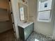 Stylish bathroom featuring a patterned tile floor, and modern vanity with a sleek mirror and light fixture at 7392 Deer Hollow Rd # 27, Sherrills Ford, NC 28673
