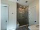 Modern bathroom features a glass-enclosed shower, a bench, and decorative tile at 7392 Deer Hollow Rd # 27, Sherrills Ford, NC 28673
