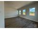 Large bedroom with many windows and wood floors at 7392 Deer Hollow Rd # 27, Sherrills Ford, NC 28673