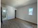 Bright bedroom with wood floors, white walls and natural light from the double-hung window at 7392 Deer Hollow Rd # 27, Sherrills Ford, NC 28673