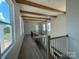 Hallway on second floor with wood beam ceilings and great natural light at 7392 Deer Hollow Rd # 27, Sherrills Ford, NC 28673