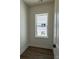 Hallway features wood flooring and great light exposure through a large window at 7392 Deer Hollow Rd # 27, Sherrills Ford, NC 28673