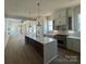 Spacious kitchen with a large island, hardwood floors, and modern appliances, perfect for entertaining at 7392 Deer Hollow Rd # 27, Sherrills Ford, NC 28673