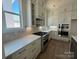 Modern kitchen with stainless steel appliances, white countertops, custom cabinets and hardwood floors at 7392 Deer Hollow Rd # 27, Sherrills Ford, NC 28673