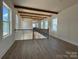 Open living area features beautiful wood flooring and natural lighting with exposed wood beam accents at 7392 Deer Hollow Rd # 27, Sherrills Ford, NC 28673