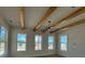Bright living room with natural light, wood beam details, and a modern chandelier at 7392 Deer Hollow Rd # 27, Sherrills Ford, NC 28673