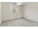 Bedroom with neutral walls and carpet, with a window overlooking the outside at 7831 Spinnaker Bay Dr # 314, Sherrills Ford, NC 28673