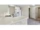 Bright kitchen features white appliances, countertop island with brick accent and nearby washer and dryer at 7831 Spinnaker Bay Dr # 314, Sherrills Ford, NC 28673
