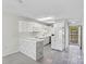 This bright kitchen offers white cabinetry, a breakfast bar, and stainless steel appliances with exterior access at 7831 Spinnaker Bay Dr # 314, Sherrills Ford, NC 28673